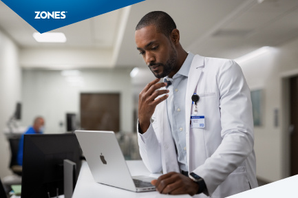 A sleek MacBook displaying healthcare applications alongside an Apple Watch showcasing health metrics, illustrating the integration of Mac technology in Apple's healthcare initiatives.